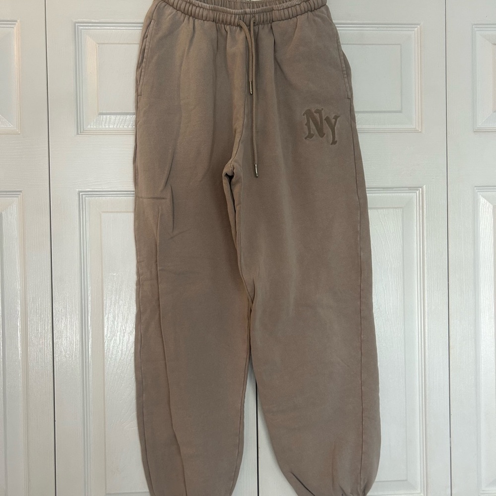 Garage small tan jogger. New York embroidered on front. Cuffed ankle